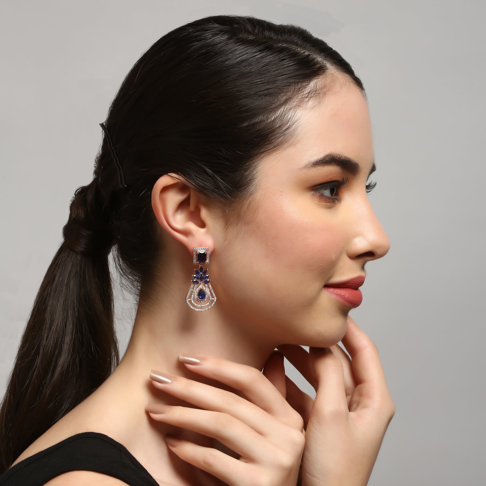 Handcrafted rose gold plated blue dangler american diamond earrings