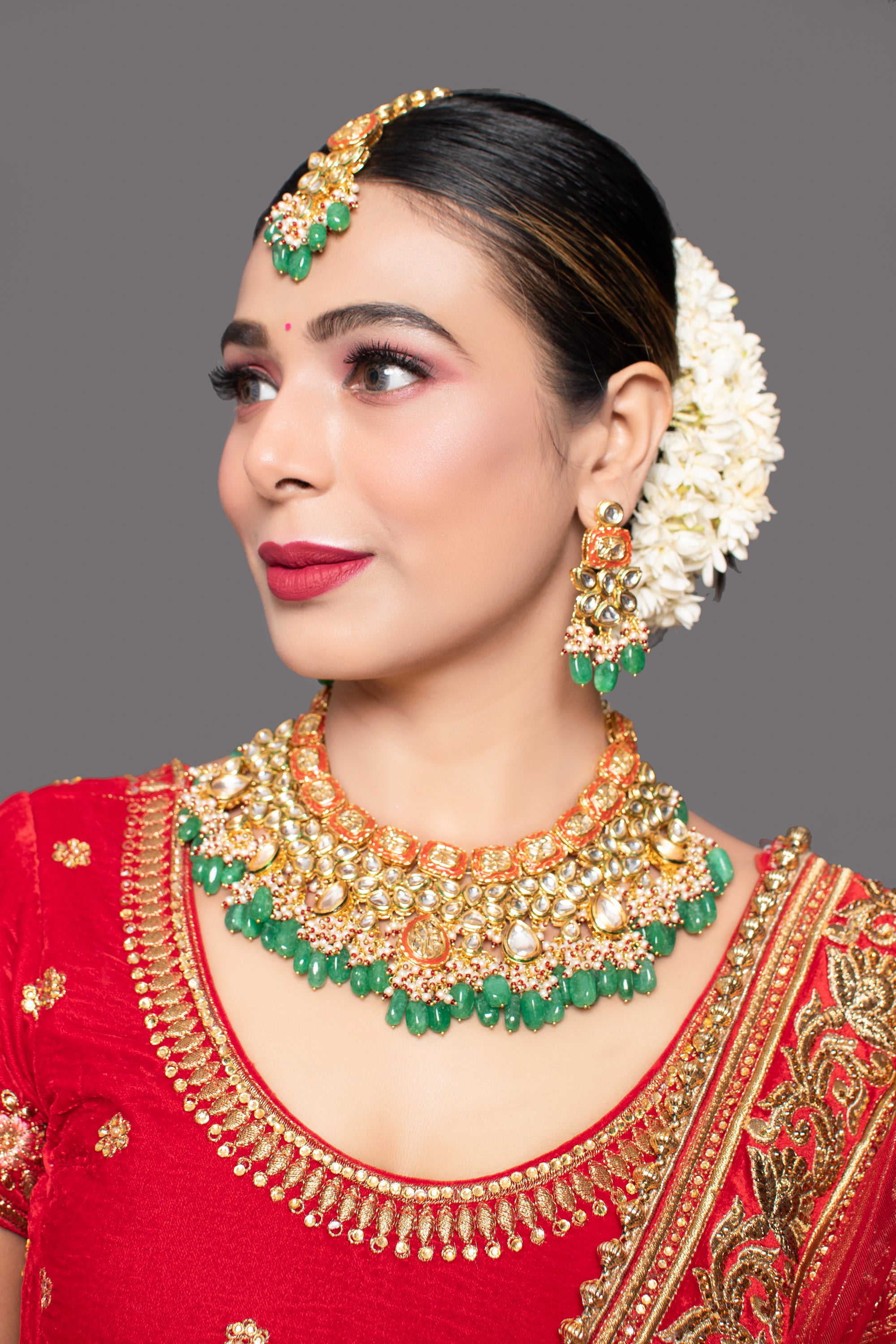 Green Red Gold toned Handcrafted Kundan necklace with matching earrings & Maang Tikka
