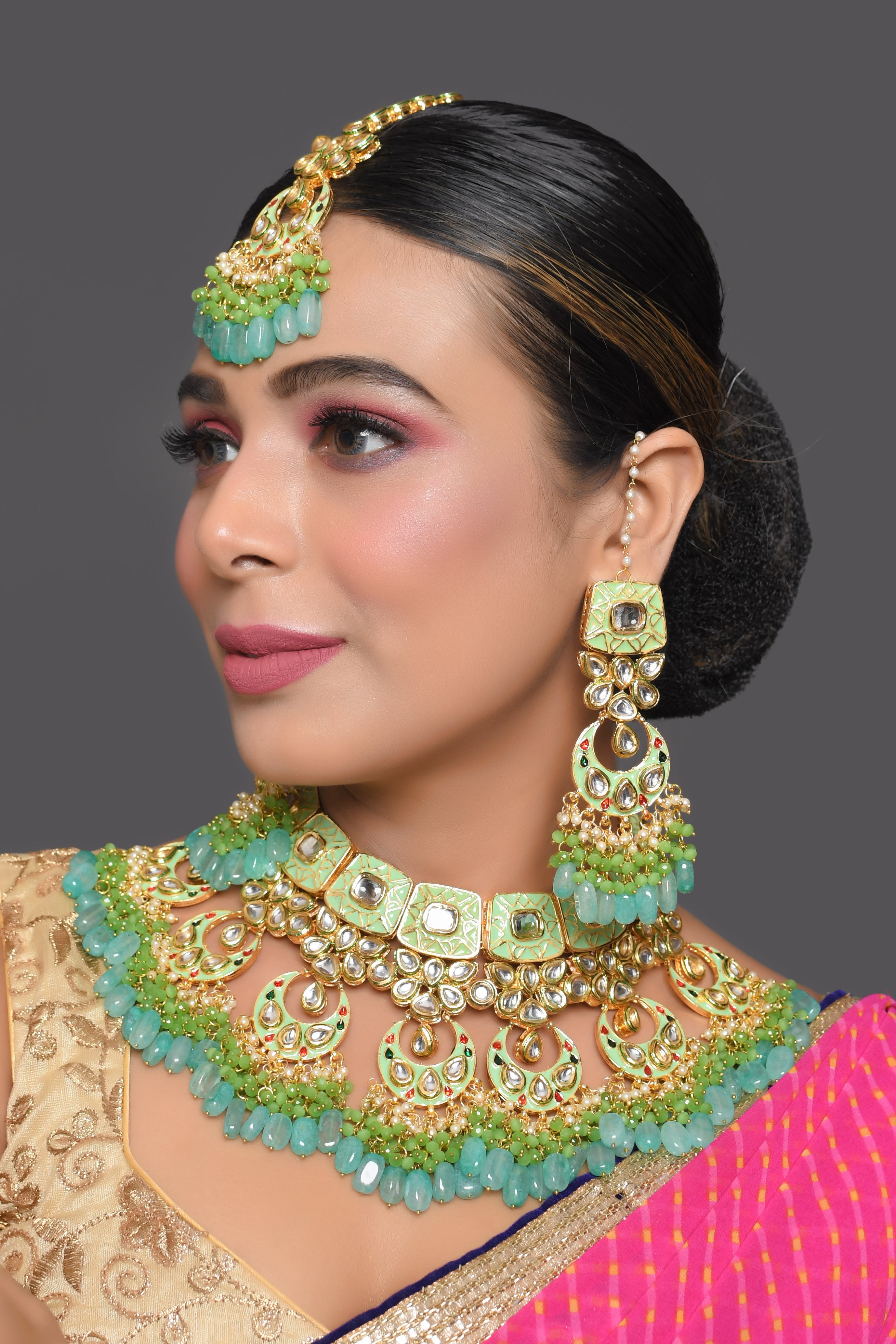 Green enameled Kundan Maharani Necklace and earrings with Maang Tikka
