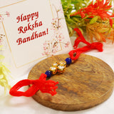 Red Gold toned blue beaded Kundan rakhi