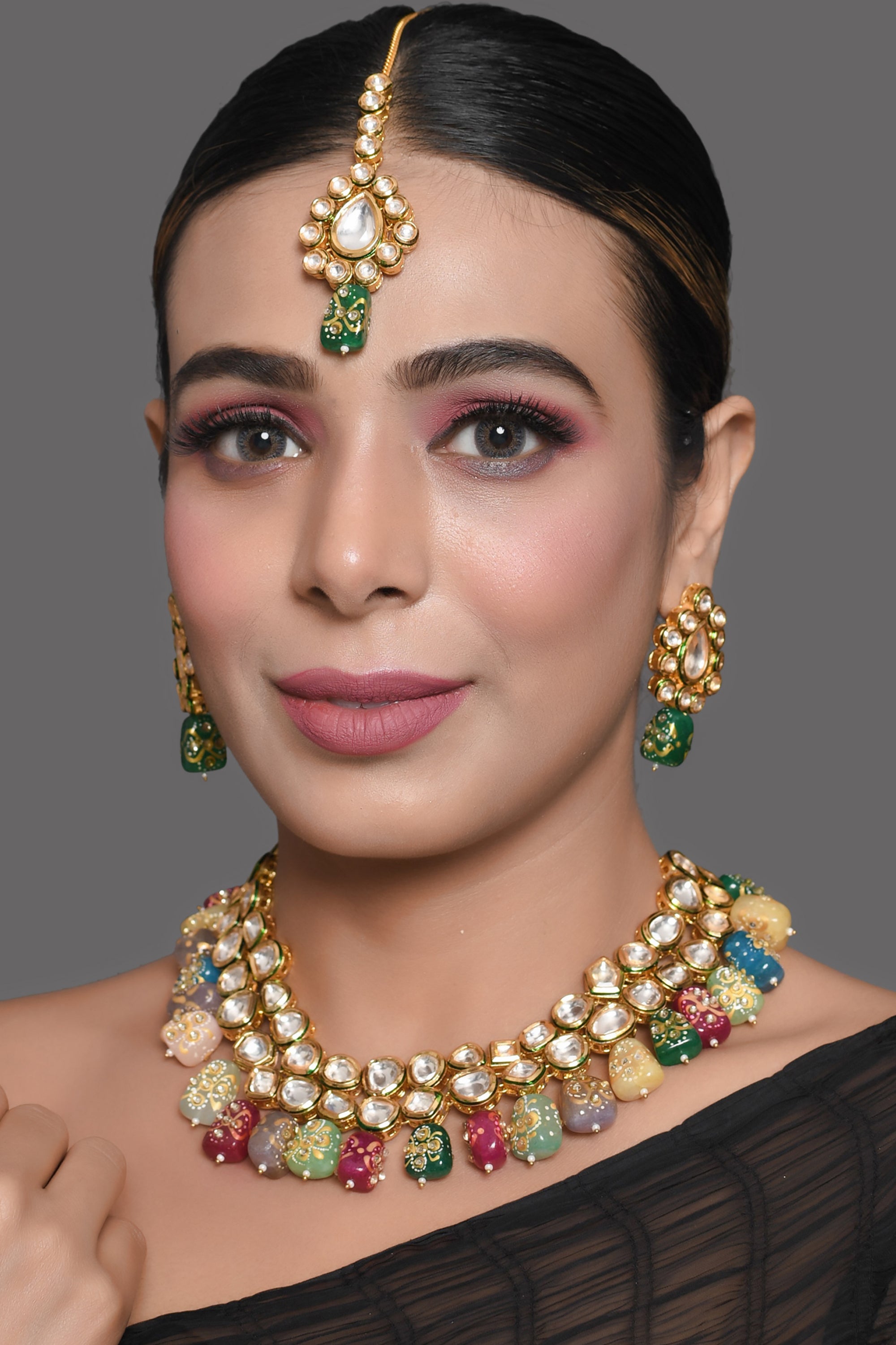 Gold toned multicolored beaded kundan necklace teamed with matching earrings & Maang Tikka