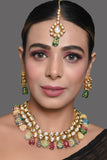 Gold toned multicolored beaded kundan necklace teamed with matching earrings & Maang Tikka