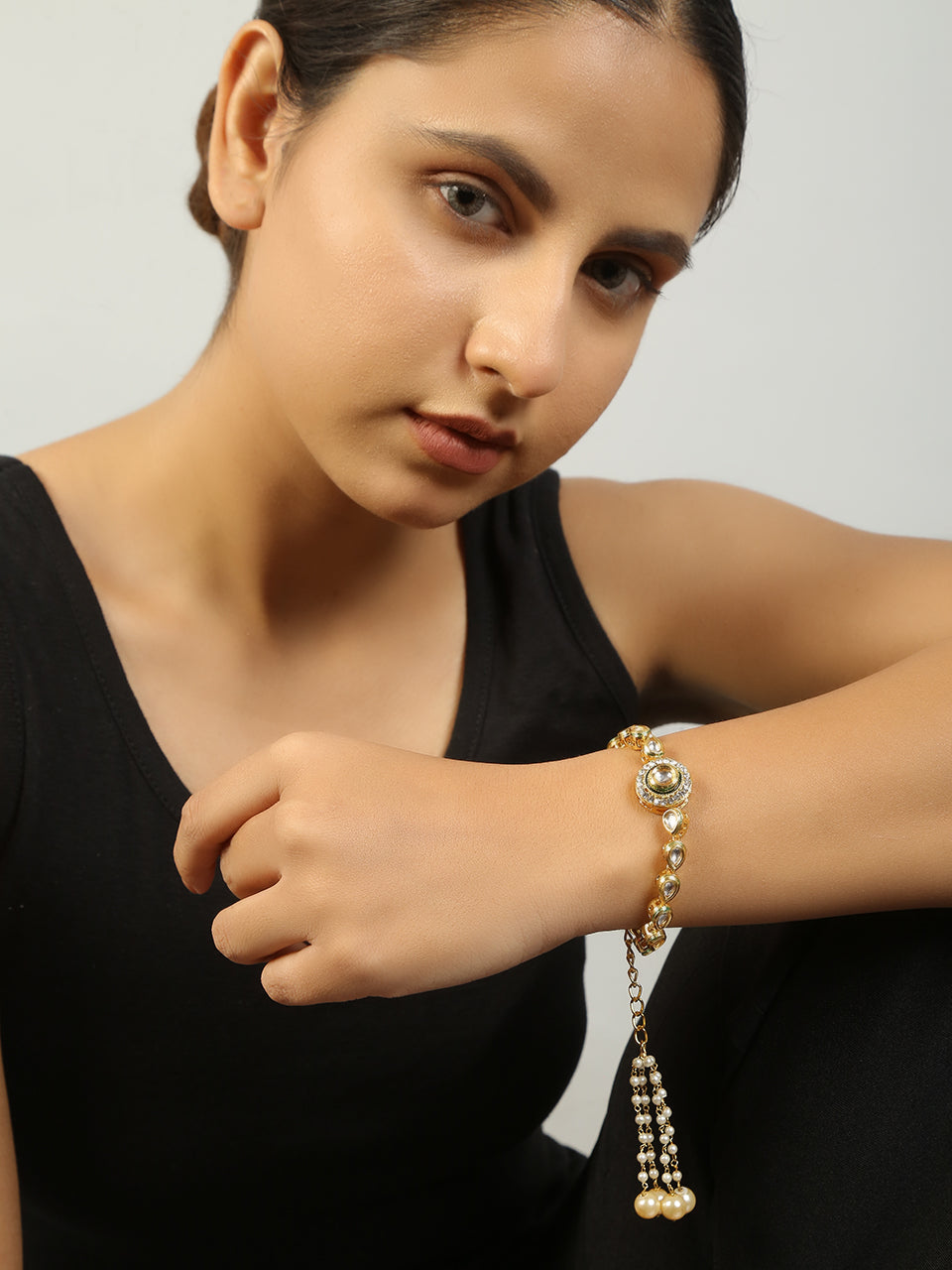 Gold toned kundan inspired bracelet with pearls