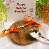 Gold Tone Kundan Rakhi with red yellow cotton thread