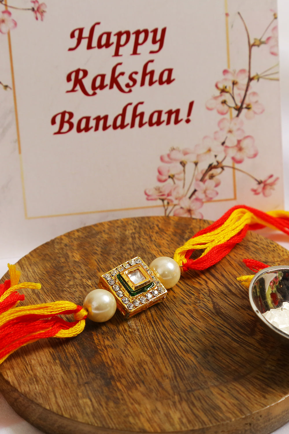 High quality Kundan studded rakhi with yellow cotton thread