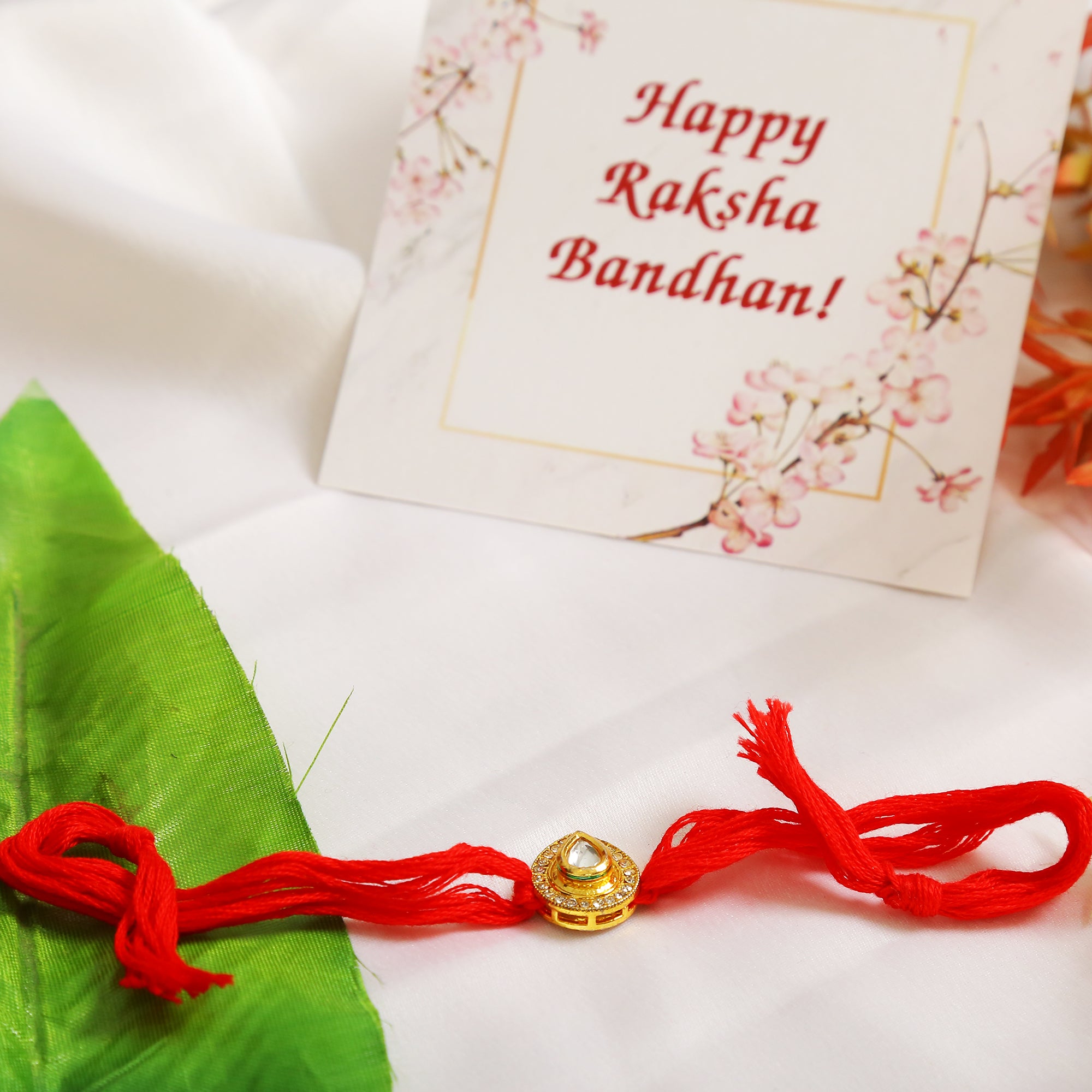 High quality Kundan studded rakhi with yellow cotton thread