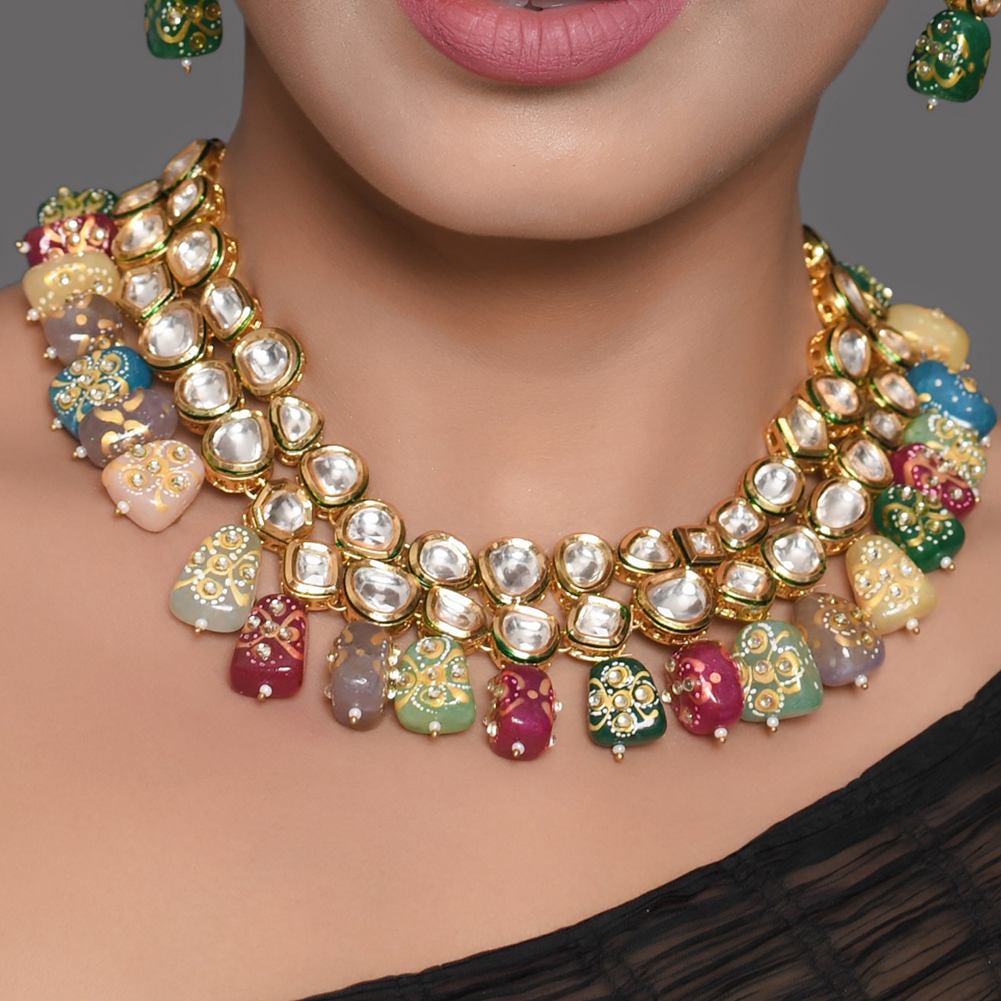 Gold toned multicolored beaded kundan necklace teamed with matching earrings & Maang Tikka