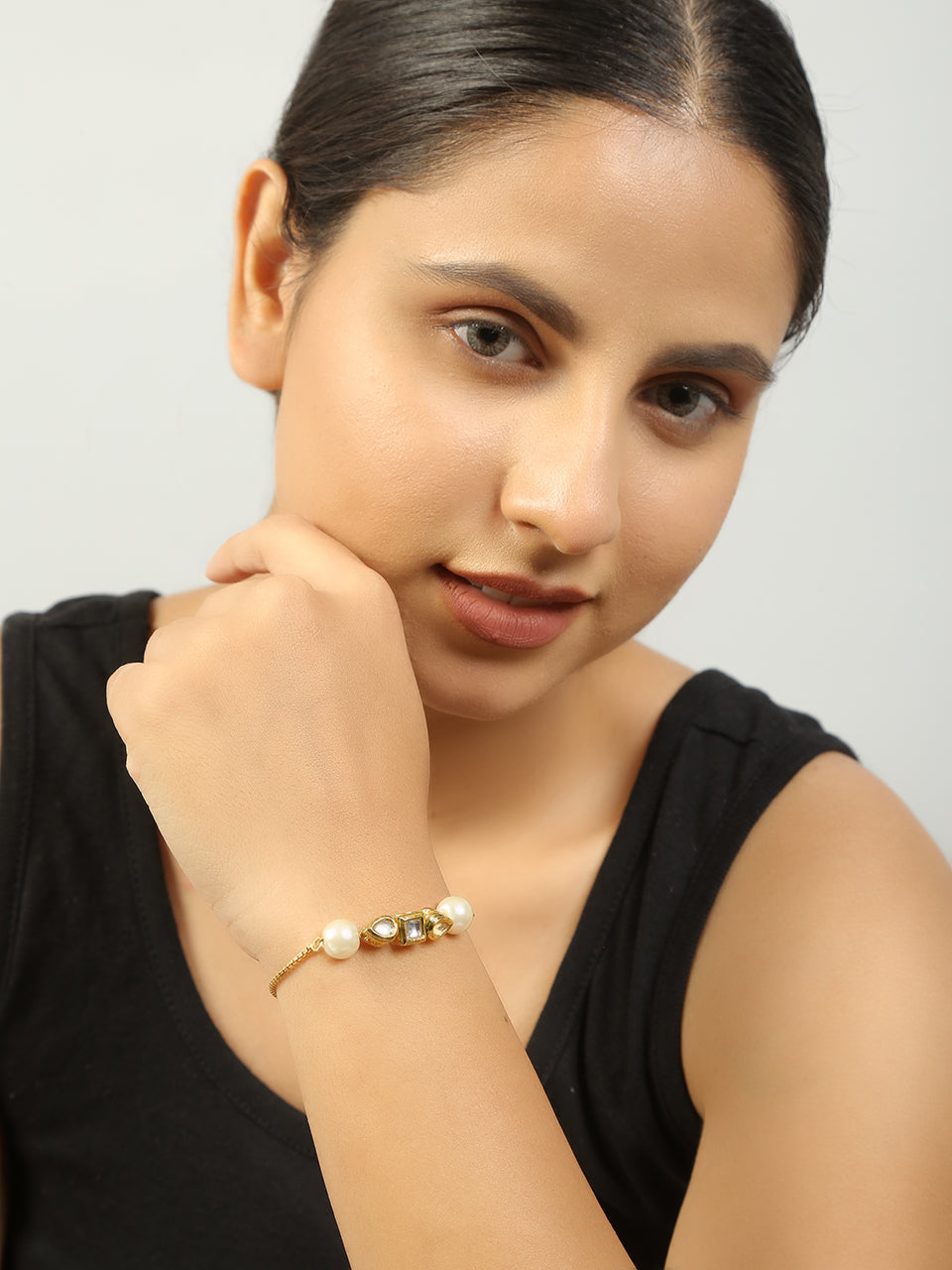 Gold toned kundan inspired bracelet with pearls