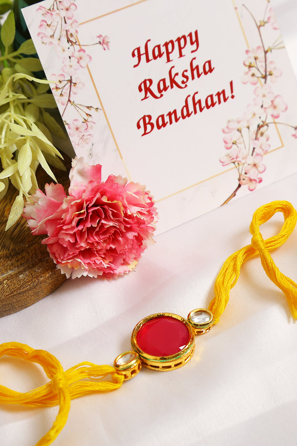 Red Gold Tone Kundan Rakhi with  yellow thread