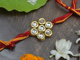 Kundan floral  Gold Tone Kundan Rakhi with red yellow cotton thread