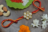 Kundan floral  Gold Tone Kundan Rakhi with red yellow cotton thread