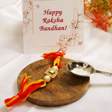 High quality Kundan studded rakhi with yellow cotton thread